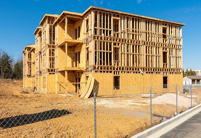 a temporary chain link fence locking away a building under renovation, serving as a security tool in Deer Park, IL